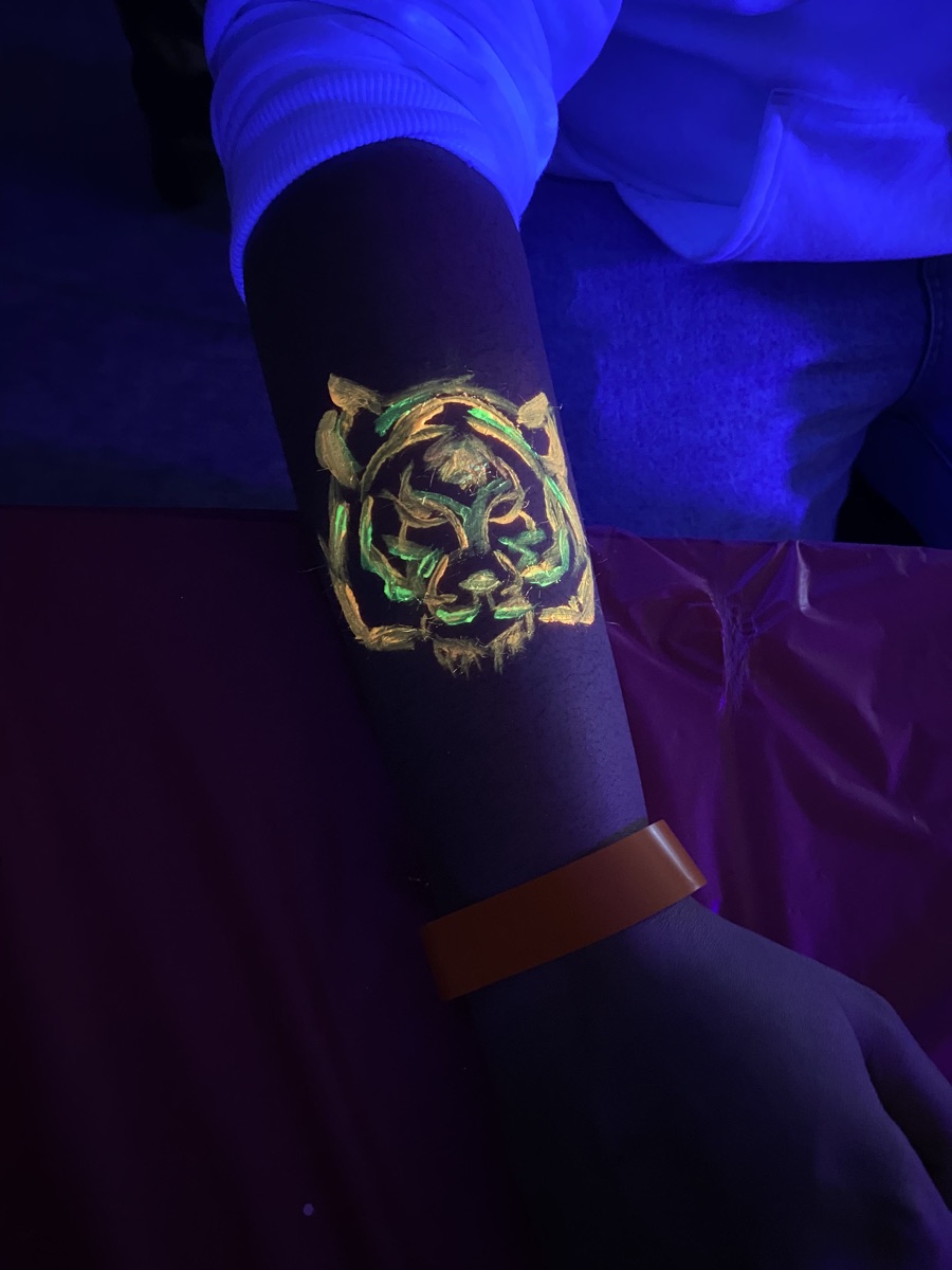 Glow party body and face paint at MUN Glow Party